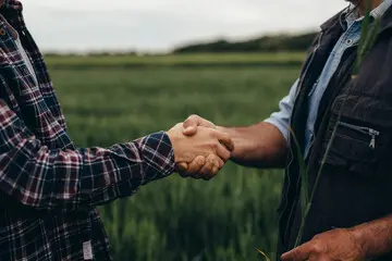 two farmers shaking hands