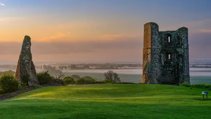 ruined castle standing in a field