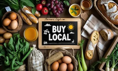 fresh produce with a sign saying buy local