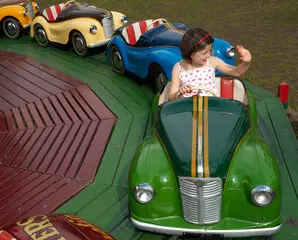 girl on a vintage fair ride